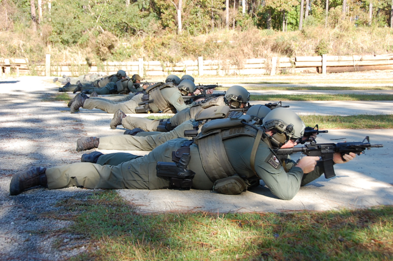Five officers using the shooting range