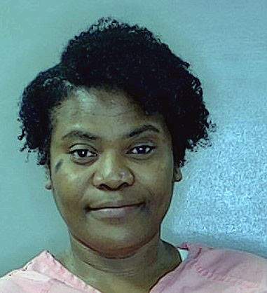 WOMAN WITH FIREARM ARRESTED AT SCHOOL 