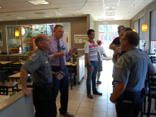 Deputies and Citizens in a coffee shop talking