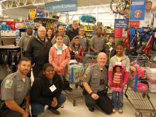 Deputies in a toy store with children